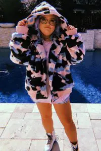 Lauren Godwin in amazing hoodie at the edge of swimming pool